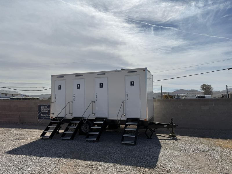 Large multi-room restroom trailer with separate steps to each room