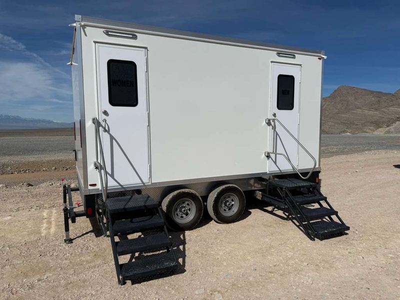 Restroom and shower combination trailer with steps at both doors